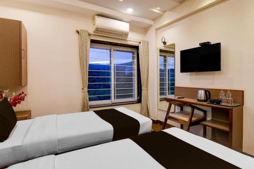 Ένα ή περισσότερα κρεβάτια σε δωμάτιο στο Townhouse The 36 Inn Madhuravada Bus Stop