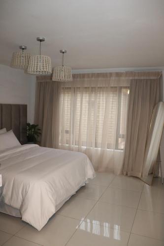 En eller flere senge i et værelse på The Hide Nongoma