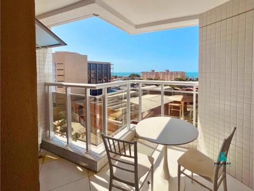 a balcony with a table and chairs and a view at Aquarius Style by Holiday Stays in Fortaleza