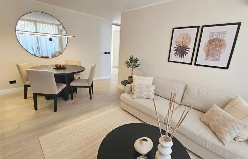 a living room with a couch and a table at LUUM by Norus in Santiago