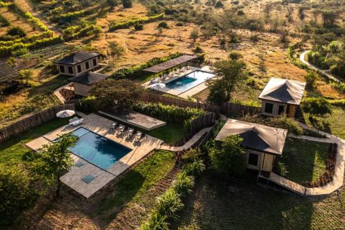 an aerial view of a house with a swimming pool at Olkupelia Mara in Talek