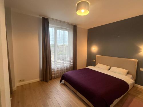 Postel nebo postele na pokoji v ubytování M27 Apartments