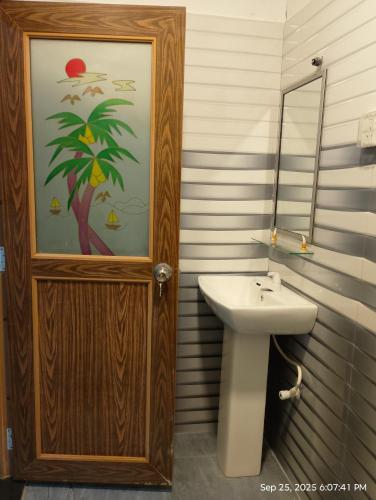 a bathroom with a sink and a mirror at Yala Eagle Nest in Tissamaharama