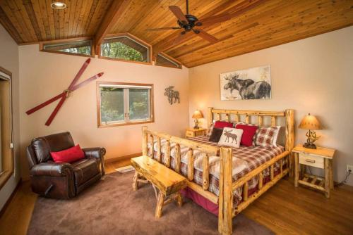 a bedroom with a bed and a ceiling fan at A-frame, Grand Views, Hot Tub, Mins To Boone & Asu in Sugar Grove
