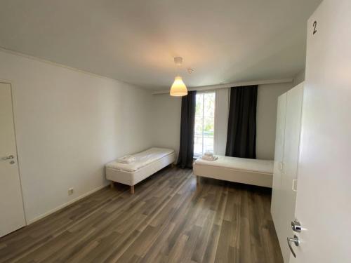 Ένα ή περισσότερα κρεβάτια σε δωμάτιο στο Practical Apartment for 2