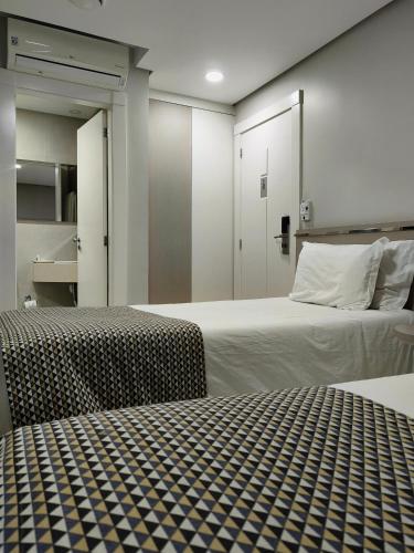 Ένα ή περισσότερα κρεβάτια σε δωμάτιο στο Hotel San Pietro