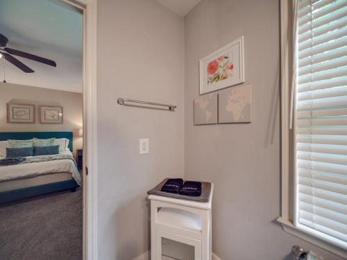 a room with a bedroom with a bed and a window at 4 BR South Charlotte Getaway Min to Everything in Charlotte