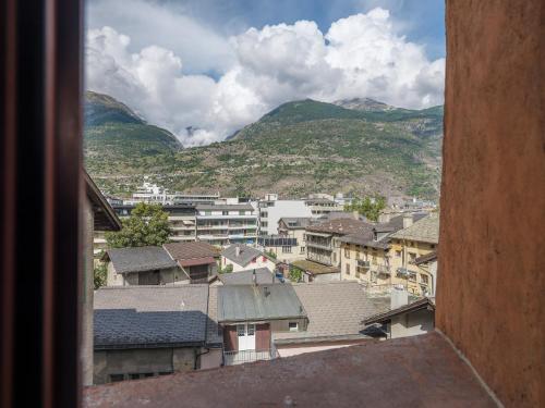 a view of a city with buildings and mountains at Cricerhaus in Visp