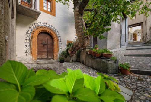an entrance to a building with a wooden door at Cricerhaus in Visp