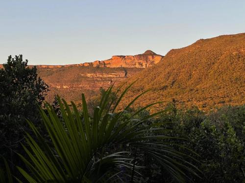 a view of a canyon with mountains in the background at Vila Verde in Palmeiras