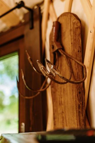 a wooden door with some ropes on it at Jurty za winklem ze strefą SPA in Rudnica
