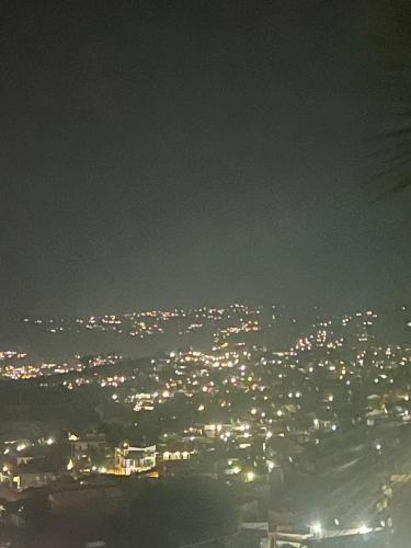 a view of a city lit up at night at KIGALi VIEW HOMES & SUITES in Kigali