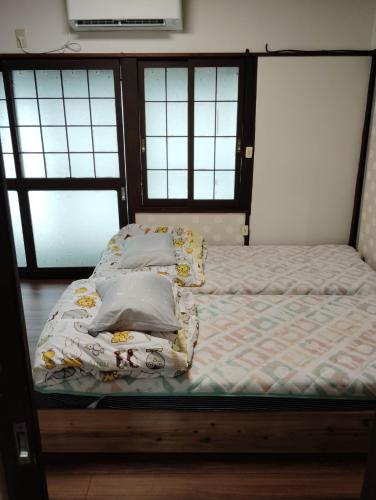 Postel nebo postele na pokoji v ubytování Ishinomaki - House - Vacation STAY 30731v