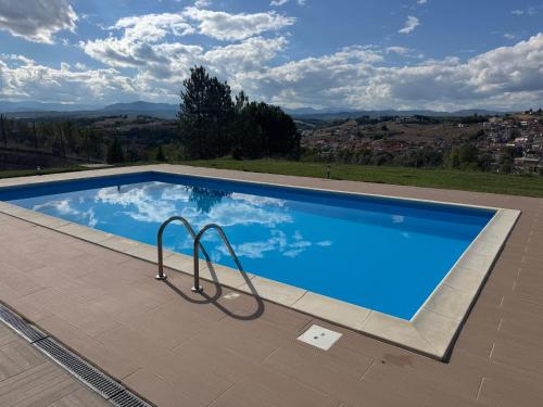 a swimming pool with a view of the mountains at Villa Rafaela in Grevena in Grevena