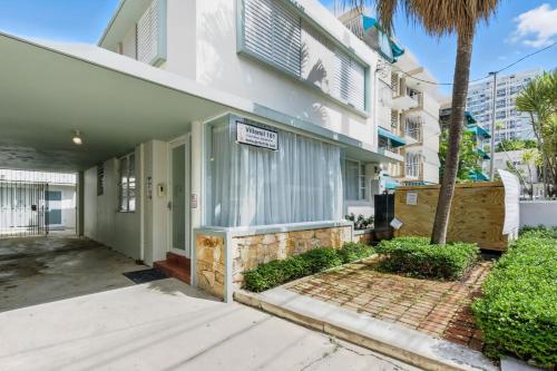 a house with a sign on the front of it at Pr Rentals Walk To La Placita & Condado Beach in San Juan