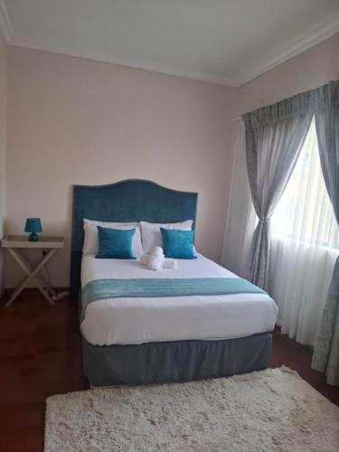 Postel nebo postele na pokoji v ubytování Sea Breeze Valley 2