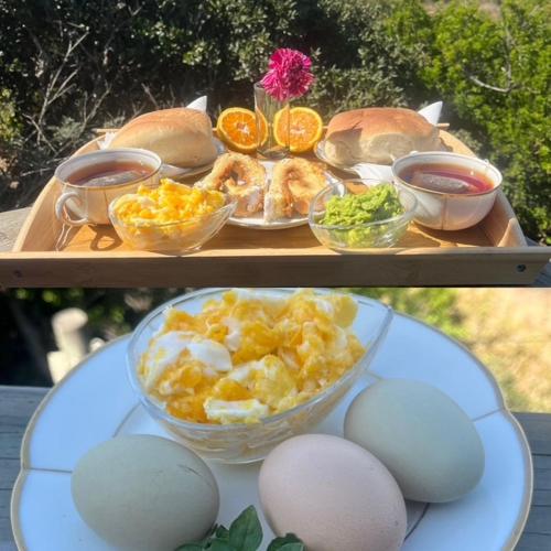 a tray of food with eggs and sandwiches on a table at Horizonte Infinito in Tunquen