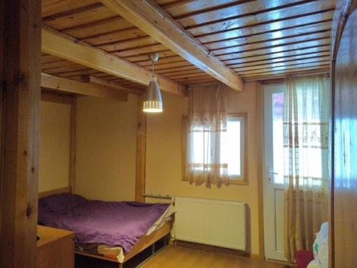 Postel nebo postele na pokoji v ubytování Holiday home in a beautiful ski resort Bakuriani