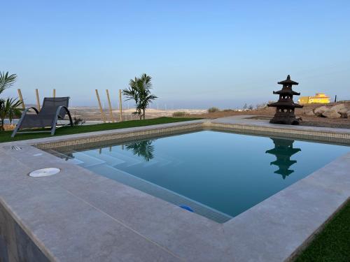 a swimming pool in the middle of a yard at Finca La Suerte in Chimiche