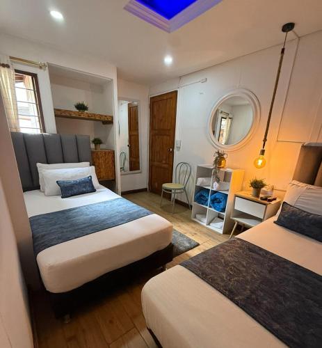Una cama o camas en una habitación de The Garden Lleras 10