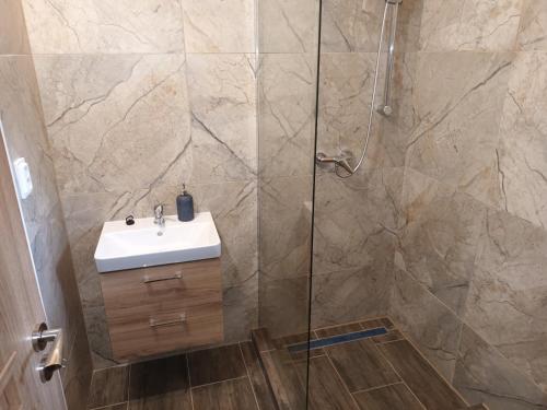 a bathroom with a sink and a shower at Chata u Repáňov in Terchová