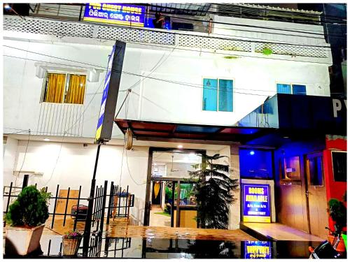 a white building with an entrance to a building at Hotel P-V-R 50 Meters Only From Railway Station With Free Internet Services in Bhubaneshwar