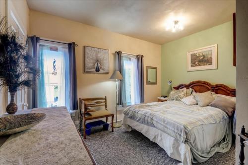 a bedroom with a bed and a chair in it at Relax & Reboot 