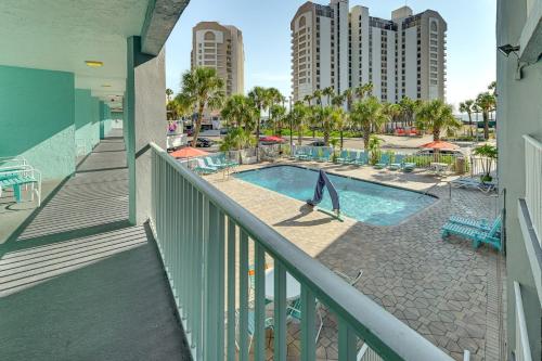 a balcony with a swimming pool with a dolphin statue at Pelican Point on Clearwater Beach in Clearwater Beach