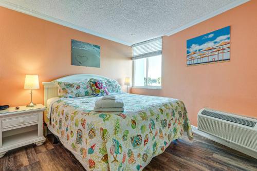 a bedroom with a bed and a window at Pelican Point on Clearwater Beach in Clearwater Beach