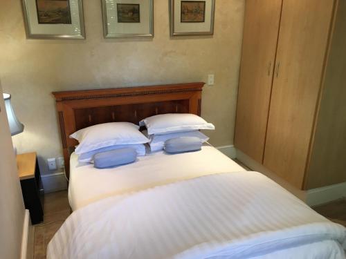 Cama o camas de una habitación en Gordons Guesthouse