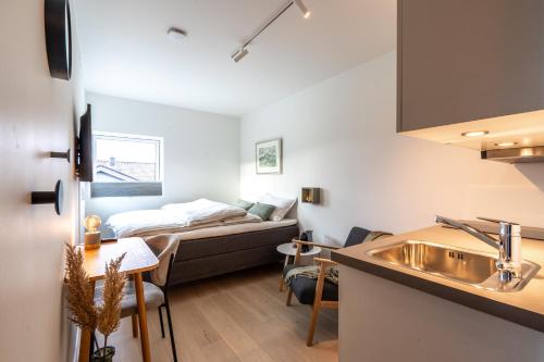 Postel nebo postele na pokoji v ubytování Aurora compact comfort