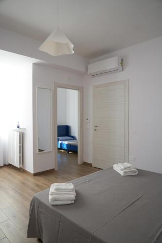 Ein Bett oder Betten in einem Zimmer der Unterkunft BlueB&B