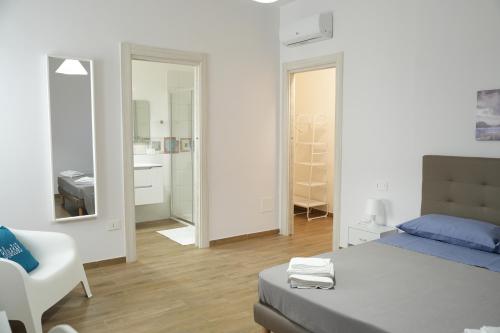 Ein Bett oder Betten in einem Zimmer der Unterkunft BlueB&B
