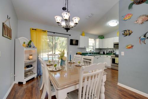 a kitchen and dining room with a table and chairs at Private Heated Pool Sunny Homosassa Stay! in Homosassa