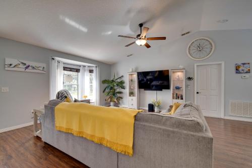 a living room with a couch and a ceiling fan at Private Heated Pool Sunny Homosassa Stay! in Homosassa