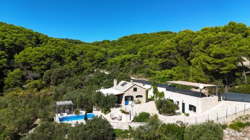 an aerial view of a house on a hill at Villa Brač in Sumartin