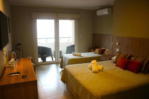 Ένα ή περισσότερα κρεβάτια σε δωμάτιο στο Terra Alta Suites
