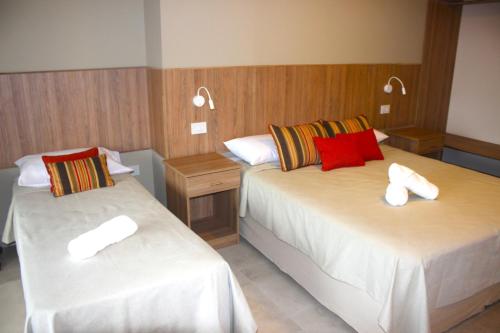 Ένα ή περισσότερα κρεβάτια σε δωμάτιο στο Terra Alta Suites