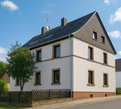 a large white house with a black roof at Suite D in Bad Dürkheim