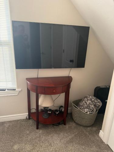 a small table with a television on a wall at Tamarack Retreat Donnelly ID in McCall