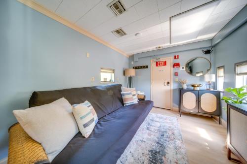 a living room with a couch and a table at The Artiste, Converted Railcar in DuBois! in Adrian Furnace