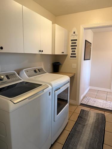 a kitchen with a white stove and a washer at Tamarack Retreat Donnelly ID in McCall