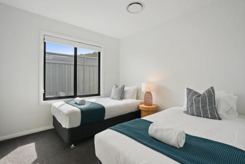 Postel nebo postele na pokoji v ubytování Grange Crescent