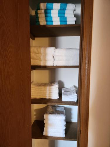 a bunch of towels are stacked in a closet at Urban Industrial- Great Location in La Salle
