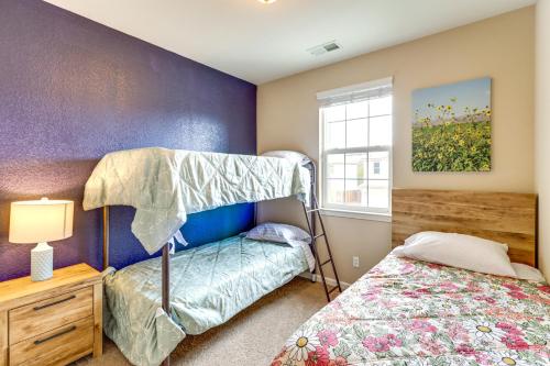 a bedroom with a bunk bed next to a window at Mountain Views Reno Home 6 Mi to Downtown! in Reno