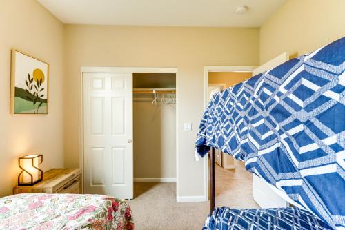 a bedroom with a bed and a closet at Mountain Views Reno Home 6 Mi to Downtown! in Reno