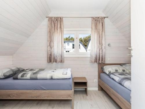 Ένα ή περισσότερα κρεβάτια σε δωμάτιο στο Cottage in Pobierowo near Baltic Beach