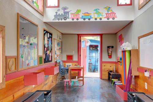 a room with a classroom with a train on the wall at The Ringmaster, Converted Railcar in DuBois! in Adrian Furnace