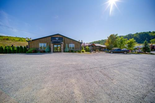 a large gravel parking lot in front of a building at Choo Choo Blue, Converted Railcar in DuBois! in Adrian Furnace