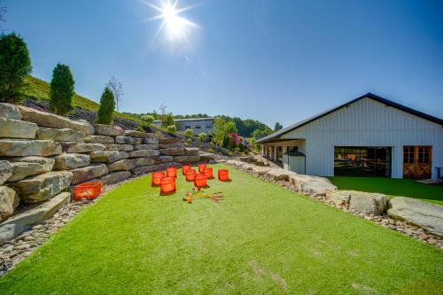 a group of orange chairs sitting on the grass at Choo Choo Blue, Converted Railcar in DuBois! in Adrian Furnace